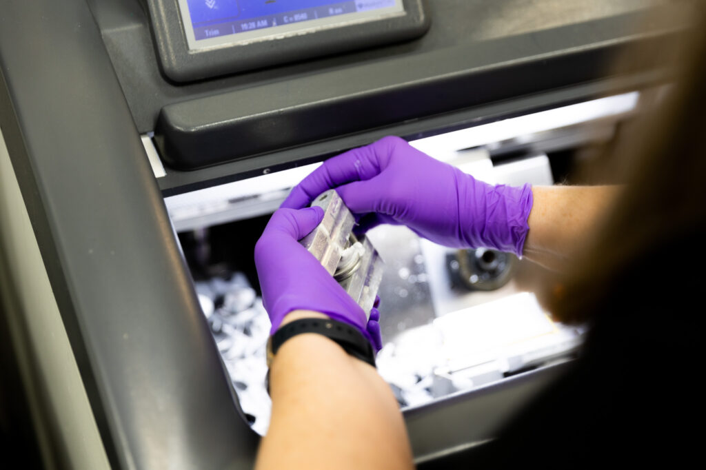 A provider at KCS&CC analyzes a skin biopsy sample. This is an important step in Mohs surgery, which is a skin cancer treatment in Kansas City, KS.